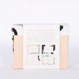 Back view of Pink, black, and white brush stroke patterned box of 60 Beautiful Thoughts Postcards by Compendium.