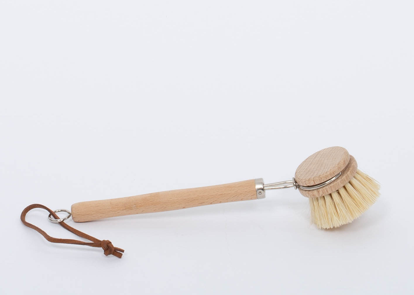 Beech Wood Flat Dish Brush with Leather Strap and silver accents for hard to reach places with angled head and nine inch handle. Brush facing down on white background. 