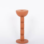 Cadwell Candle Holder stacked half moon design in natural terracotta for taper candles. Side view. White background. 