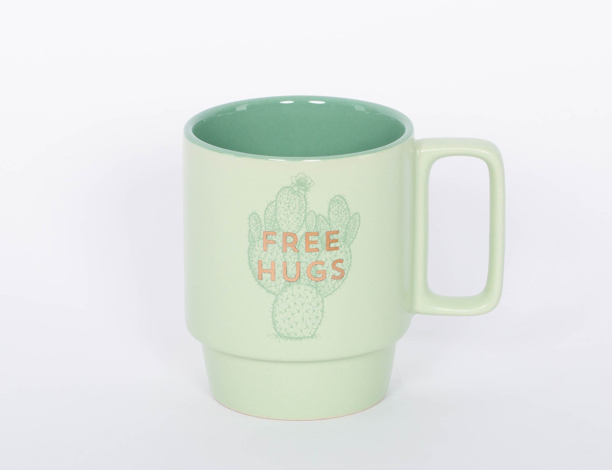 Free Hugs Mug. Crafted of high-quality ceramic, this stackable mug features a sassy sentiment in metallic gold lettering. This 12 oz. cactus mug is the perfect companion to your morning routine whether it's for a cup of coffee, hot cocoa, or tea. It also makes a great gift for the plant lover in your life!