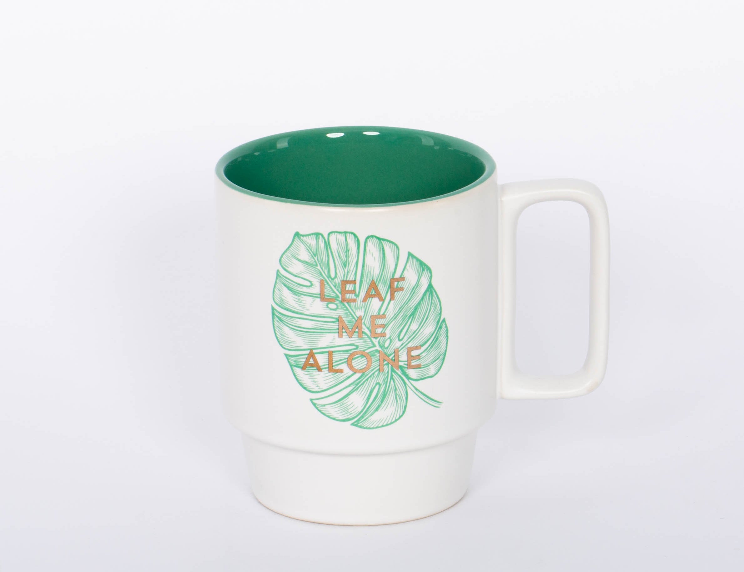 Leaf Me Alone Mug This 12 oz. monstera plant mug is the perfect companion to your morning routine whether itÕ's for a cup of coffee, hot cocoa, or tea. It also makes a great gift for the plant lover or introverted friend in your life!  3.25" D X 4.125" H 12 Oz Stackable Ceramic Mug Botanical Monstera Plant Illustration Metallic Gold Foil Accent