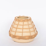Lissome Tan Vase speckled neutral toned earthenware and woven rattan accents. White background.
