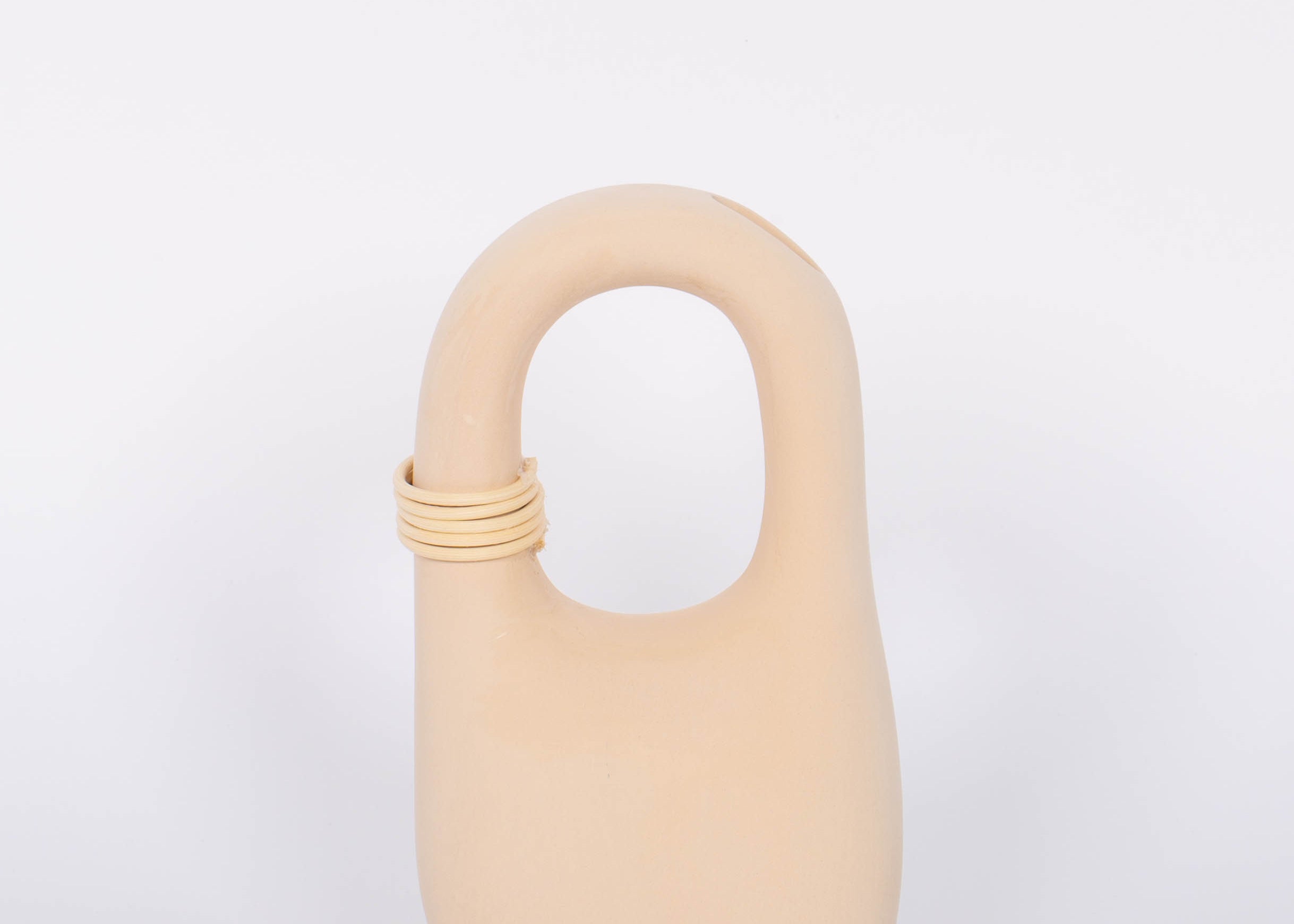 Palau Tan Vase matte finish with natural bisque cermaic, unique handle feature and wrapped rattan coil. White background.