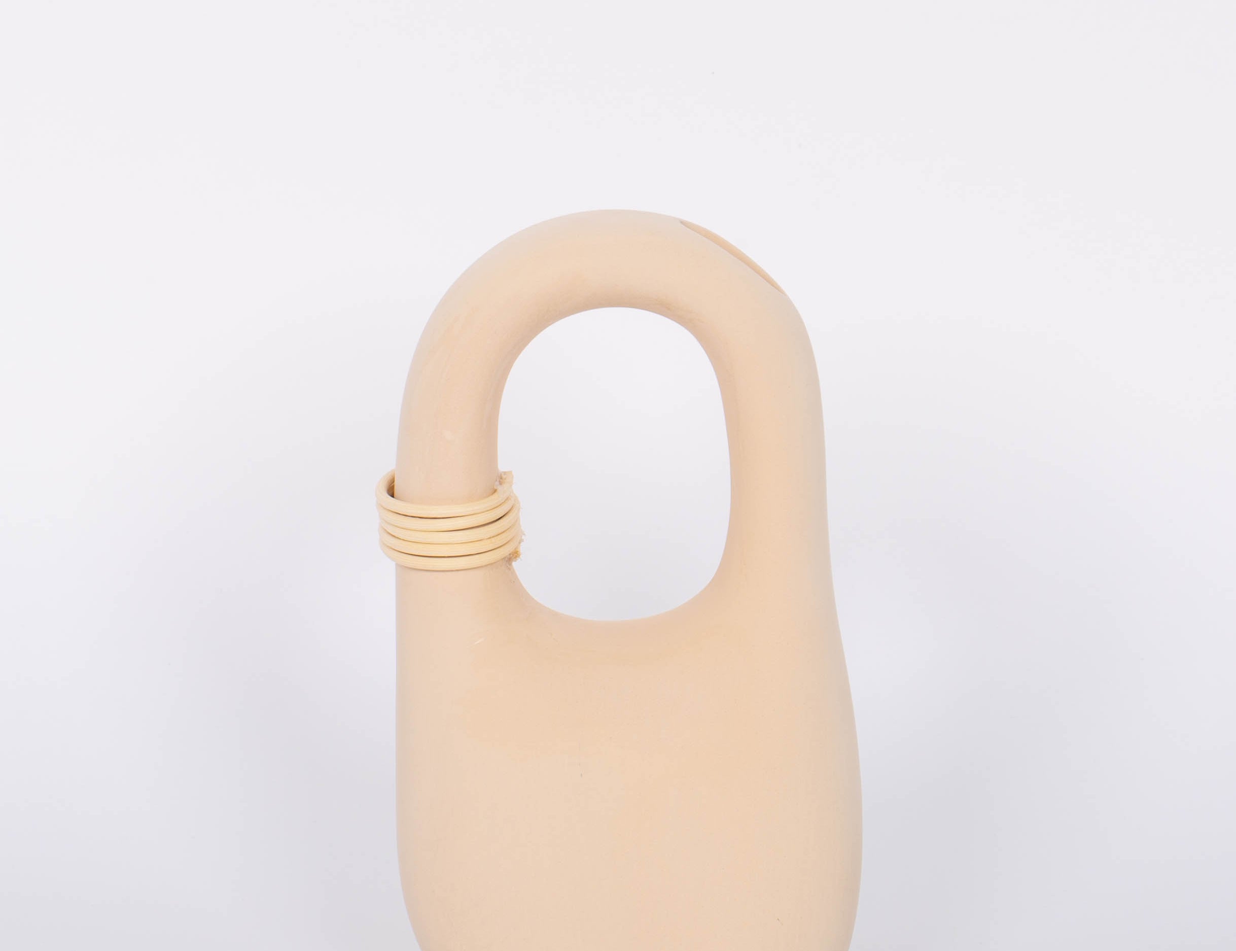 Palau Tan Vase matte finish with natural bisque cermaic, unique handle feature and wrapped rattan coil. White background.