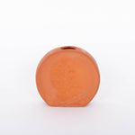 Short round Poppy Budvase in terracotta geometric silhouette with imprint of live plant. White background.
