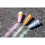 TWEE Unicorn Narwhal Chalk being used on driveway. One cool horn, one warm horn & one gold and glitter-coated white chalk horn.