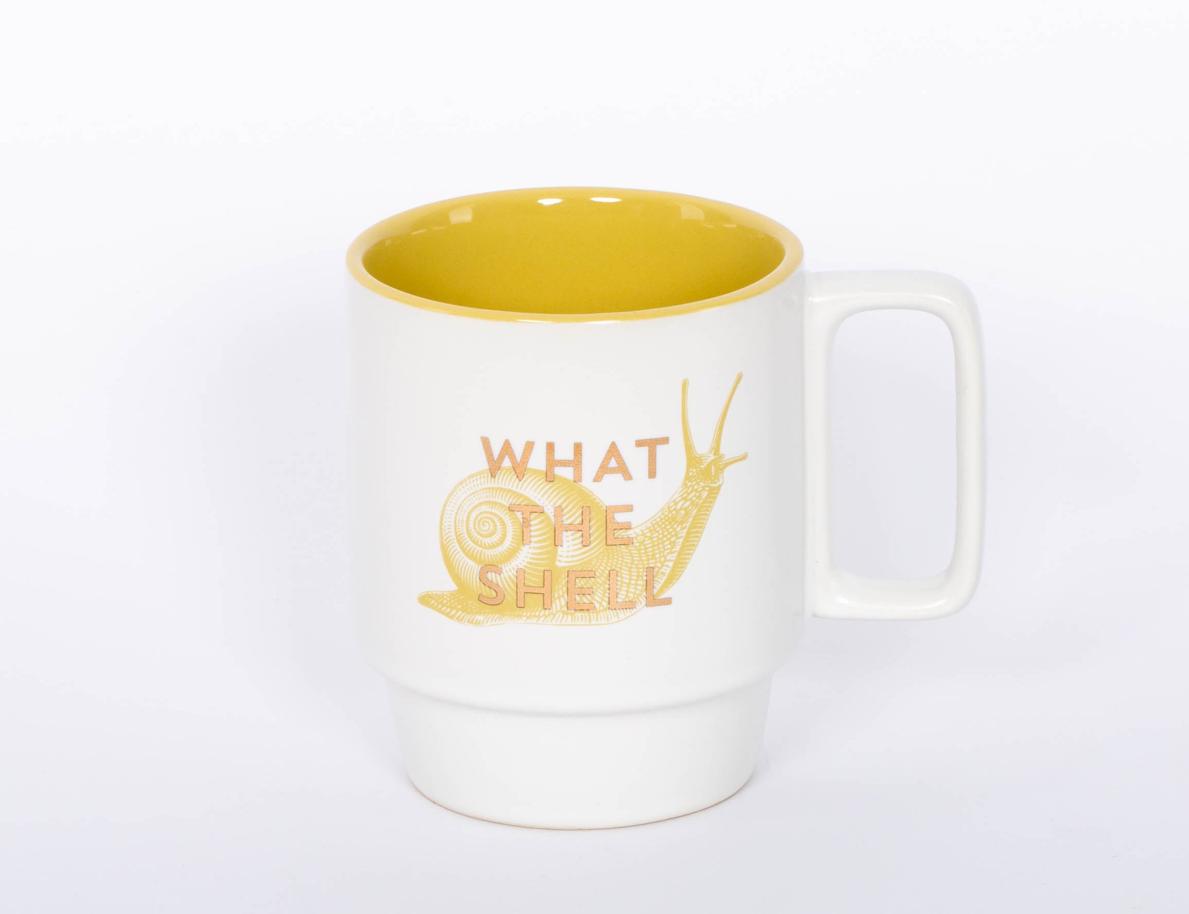 What the Shell Mug. This 12 oz. snail mug is the perfect companion to your morning routine whether it's for a cup of coffee, hot cocoa, or tea. It also makes a great gift for the witty friend or family member in your life!  3.25" D X 4.125" H 12 Oz Stackable Ceramic Mug Cute Snail Illustration Metallic Gold Foil Accent