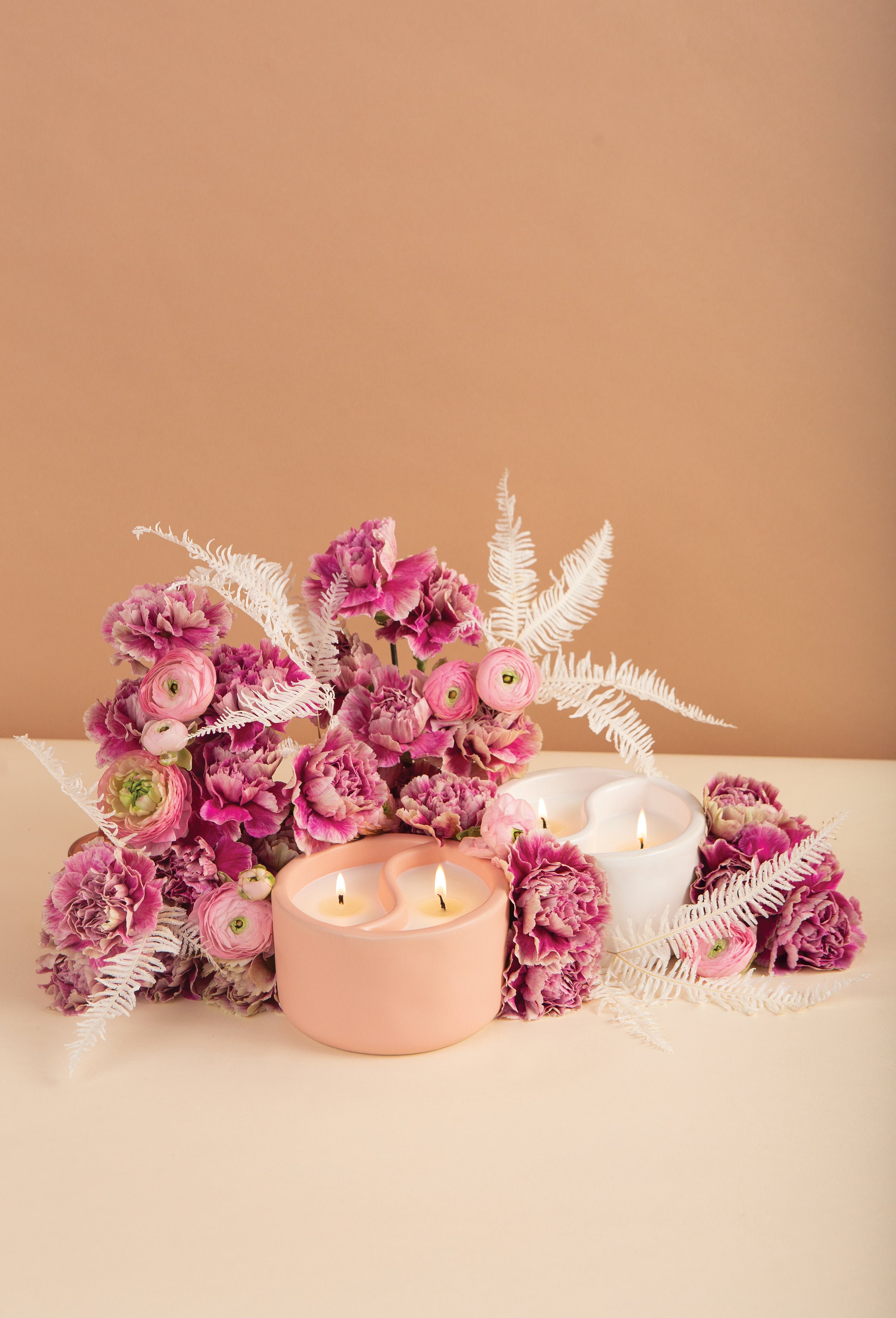 YinYang Romance candles for the home in pink and white by pink bouquet