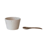 Creative Co-Op Stoneware Bowl with Mango Wood Spoon, a speckled cream bowl and a small wooden spoon