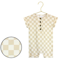 Lou Lou & Company Romper in Austin, a cream and tan checkered short-sleeve henley romper on a hanger