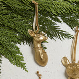 E + E Ornaments, fifteenth view, the gold doe resting on cedar greenery