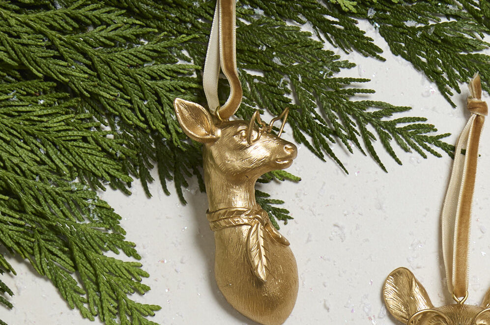 E + E Ornaments, fifteenth view, the gold doe resting on cedar greenery