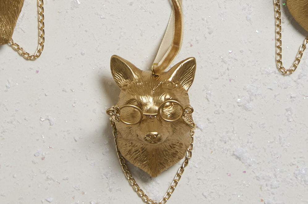 E + E Ornaments, eleventh view, the gold fox laid flat among the other animals