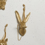 E + E Ornaments, ninth view, the gold hare laid flat among the other animals