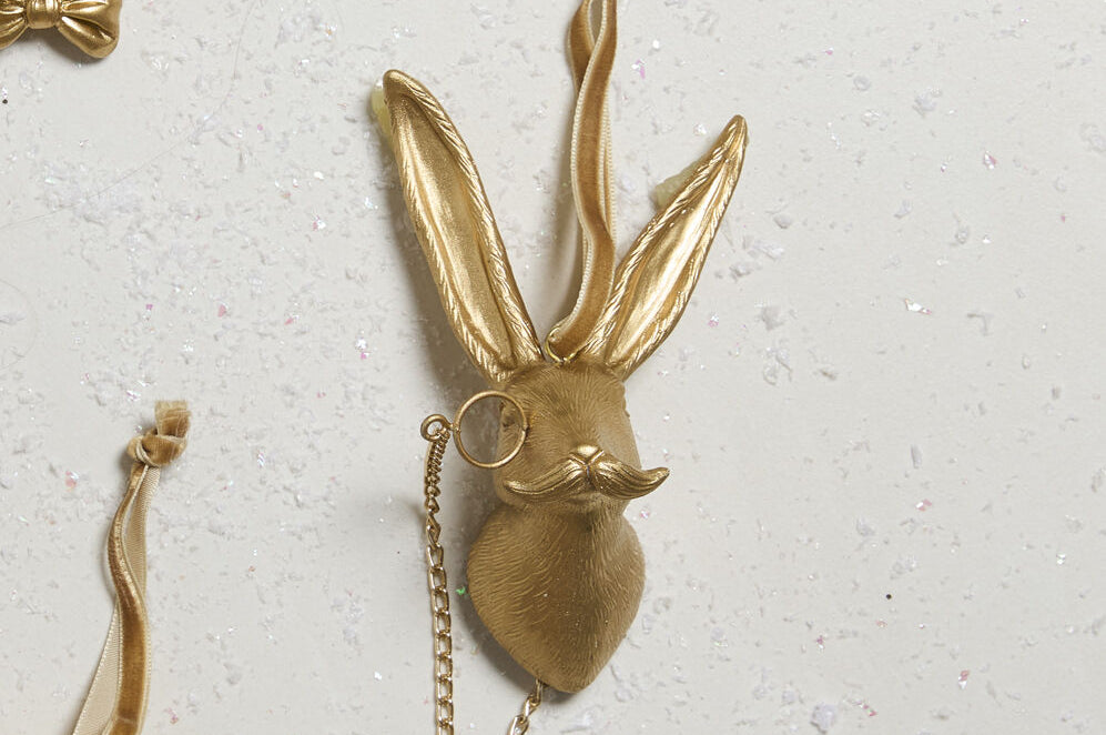 E + E Ornaments, ninth view, the gold hare laid flat among the other animals