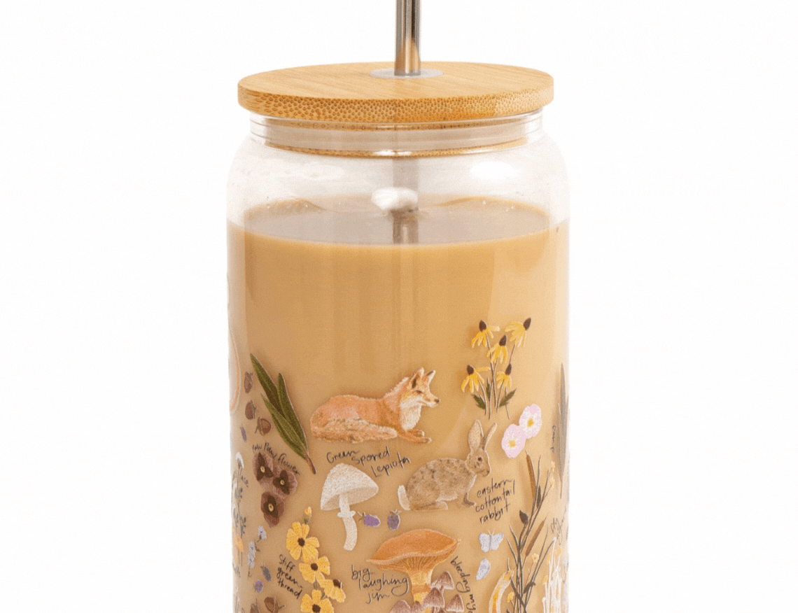 1canoe2 Flora & Fauna Glass Can with a bamboo lid and glass straw, filled with an iced coffee
