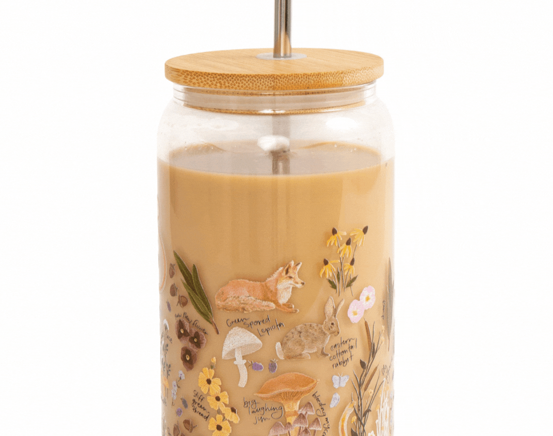 1canoe2 Flora & Fauna Glass Can with a bamboo lid and glass straw, filled with an iced coffee