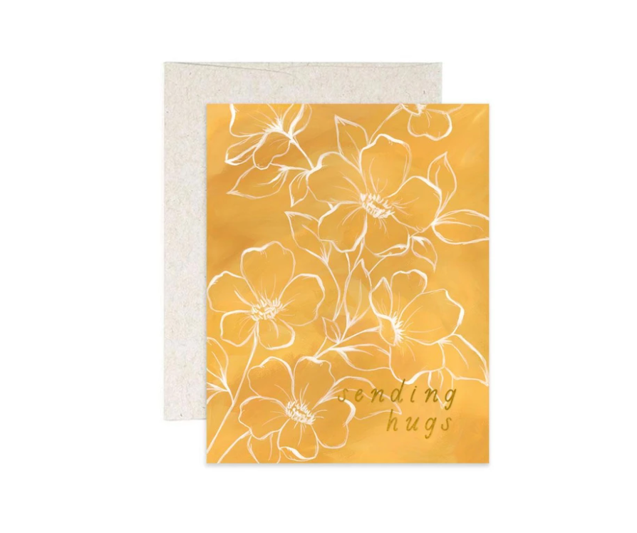1canoe2 greeting card, golden yellow card with white line-drawn flowers reading Sending Hugs, with a natural kraft envelope