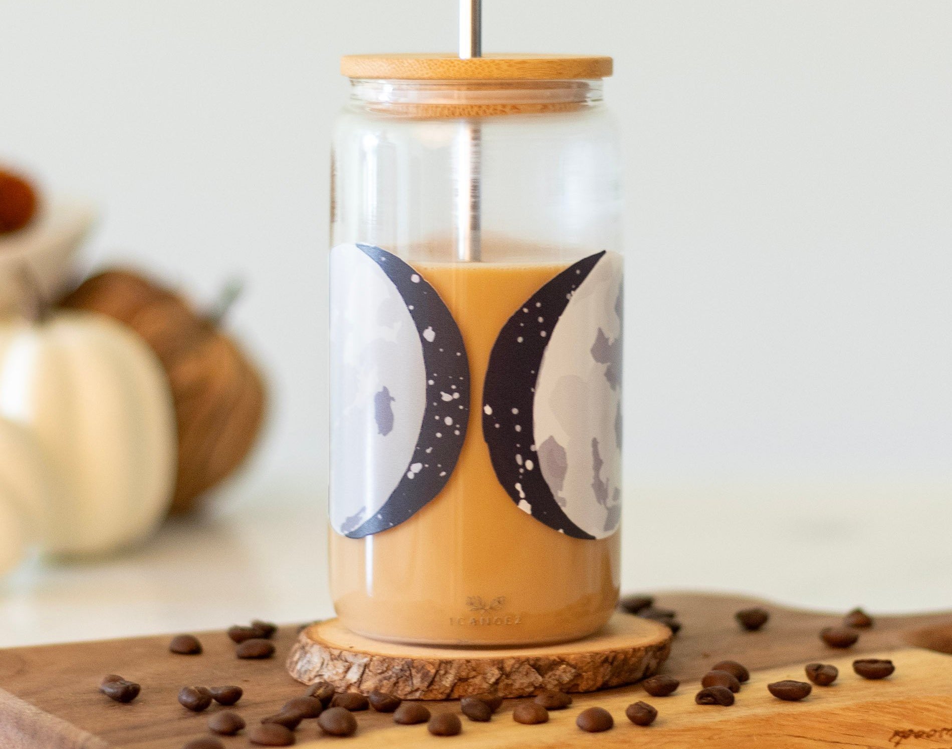 1canoe2 Moon Phases Glass Can with iced coffee on a wooden board with coffee beans