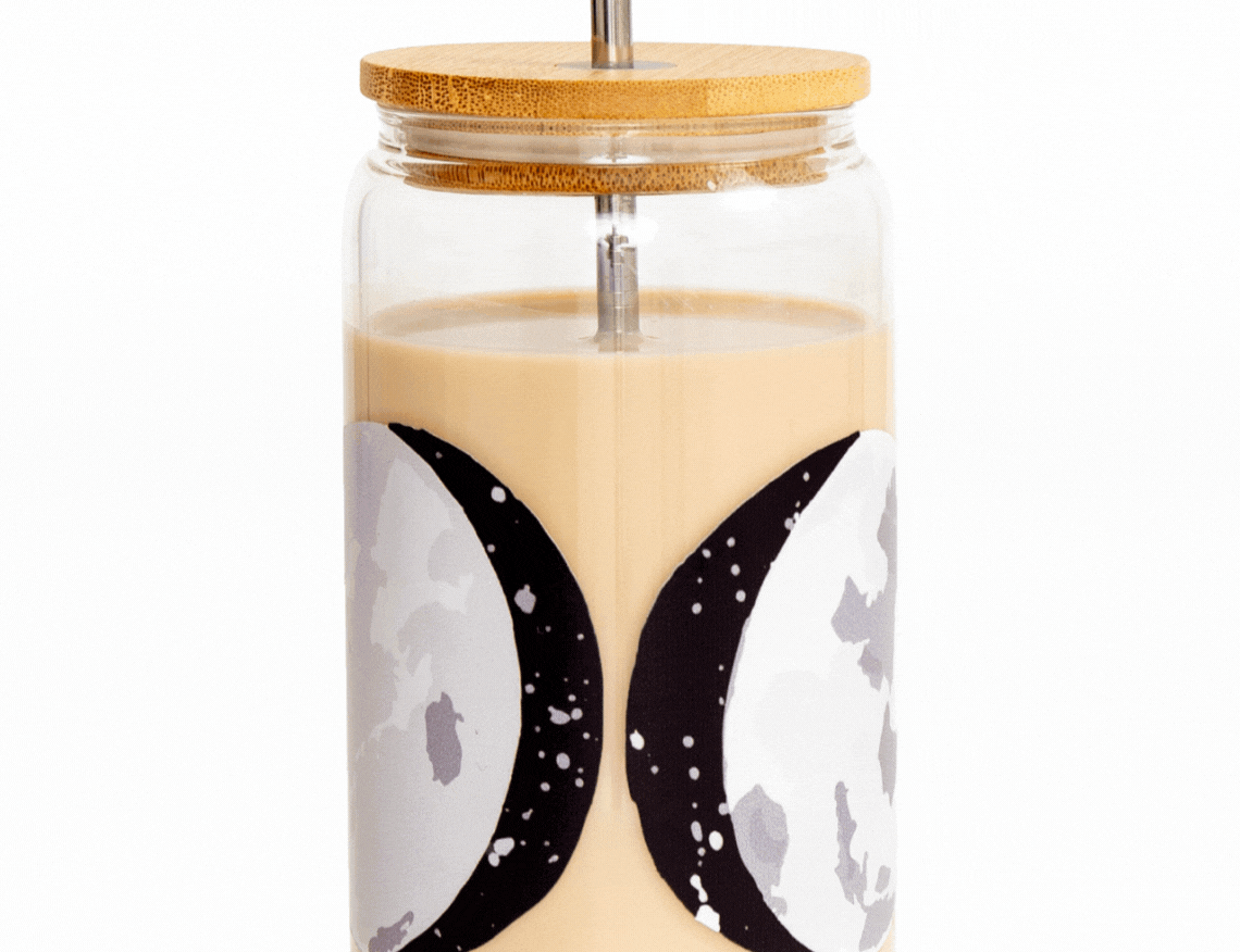 1canoe2 Moon Phases Glass Can with a bamboo lid and straw, filled with an iced latte