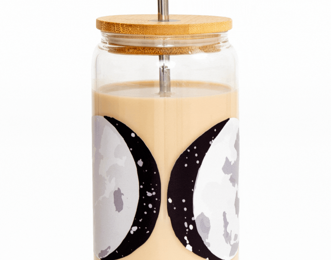1canoe2 Moon Phases Glass Can with a bamboo lid and straw, filled with an iced latte