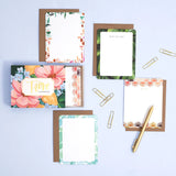 1canoe2 Trove Flat Notes with floral borders laid out with kraft envelopes and a gold pen