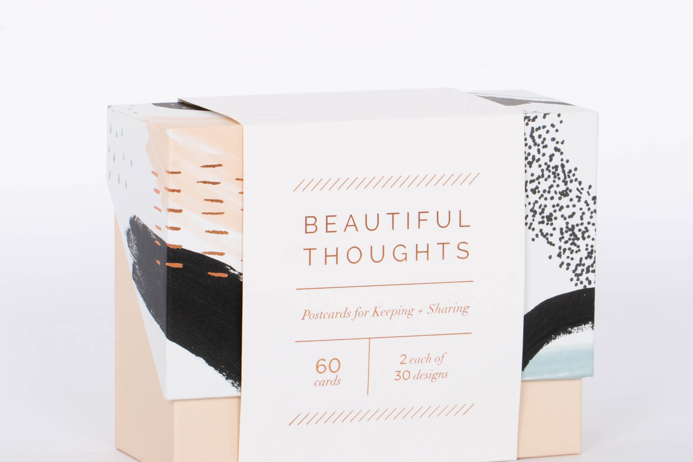 Pink, black, and white brush stroke patterned box of 60 Beautiful Thoughts Postcards by Compendium. White background.