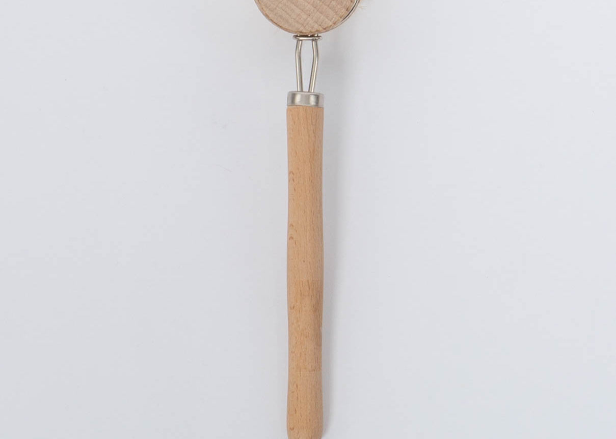 Beech Wood Flat Dish Brush with Leather Strap and silver accents for hard to reach places with angled head and nine inch handle. Brush facing down vertical view on white background.