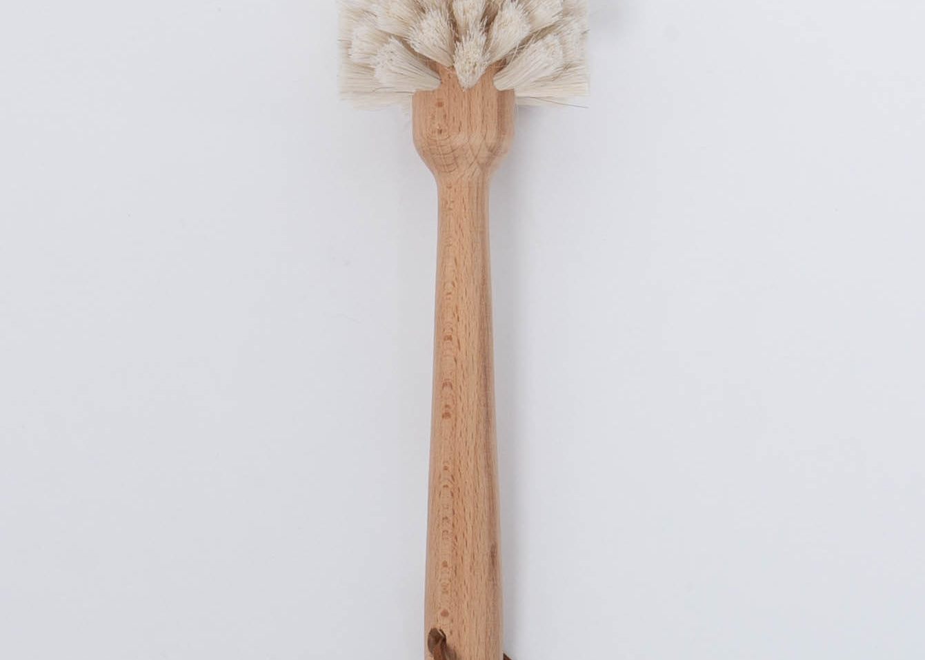 White bristle Beech Wood Dish Brush with Leather Strap by Creative Co-Op.