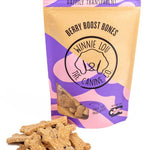 Bag of 'Berry Boost Bones' dog treats with visible treats on a white background