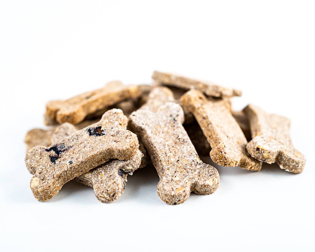 Dog treats shaped like bones on a white background