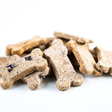 Dog treats shaped like bones on a white background