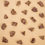 Pattern of brown rocks on a beige background