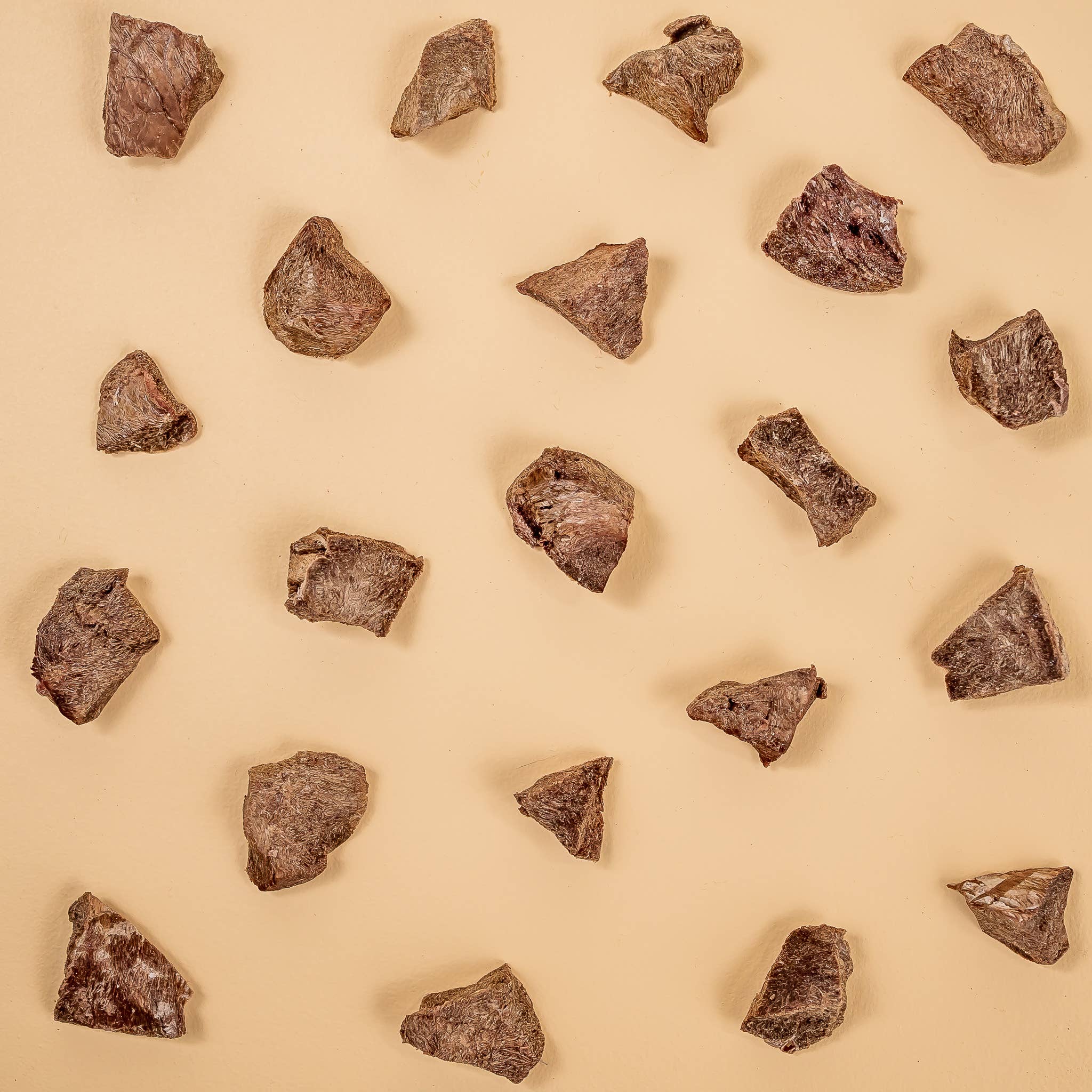 Pattern of brown rocks on a beige background