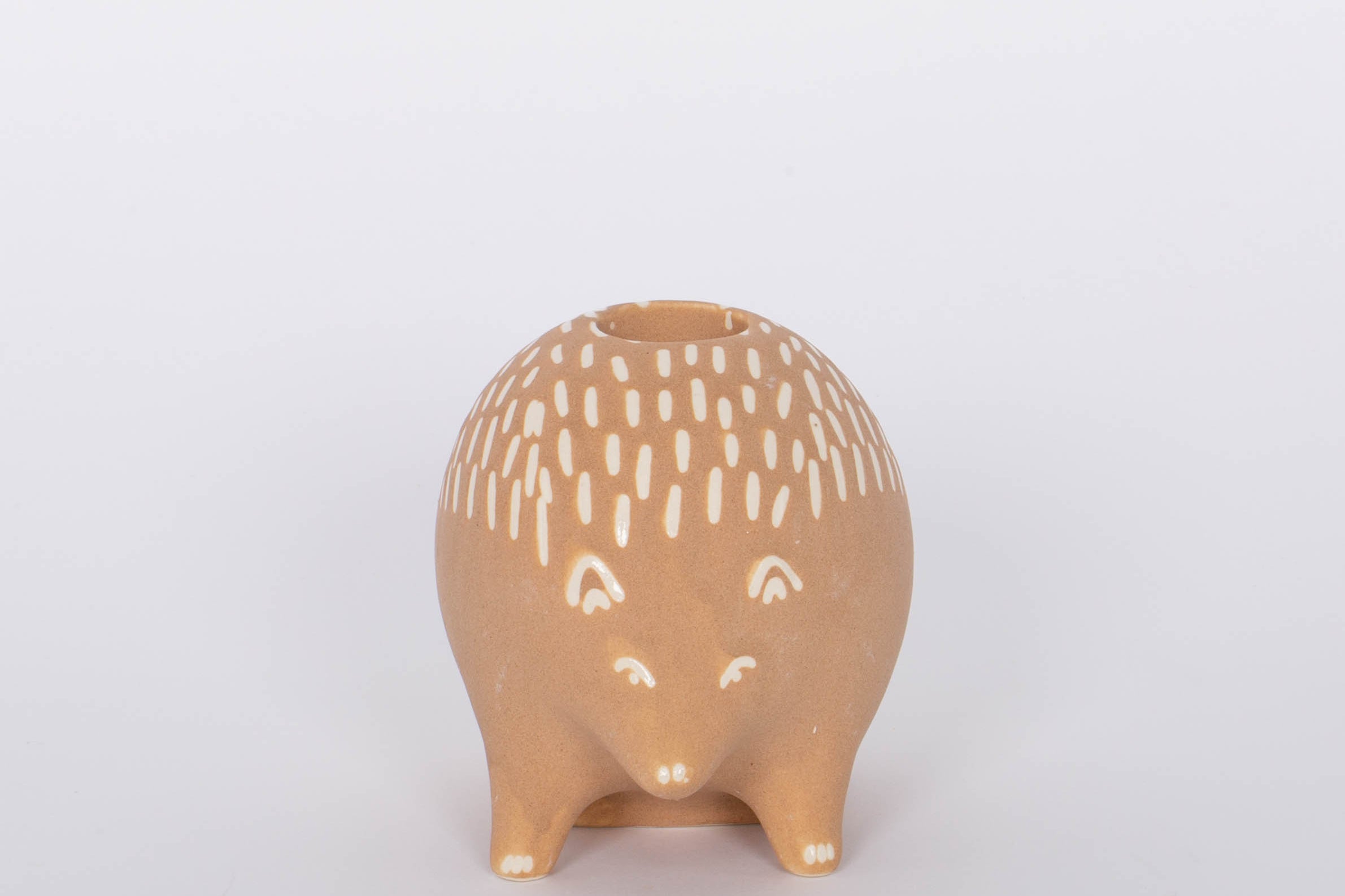 Hedgehog Bramley Candle Holder. Intricate design features carefully crafted metal branches that cradle the candle for a unique and romantic look. Incredibly versatile, this piece can be used to create an intimate ambiance or simply as a beautiful home accent. 