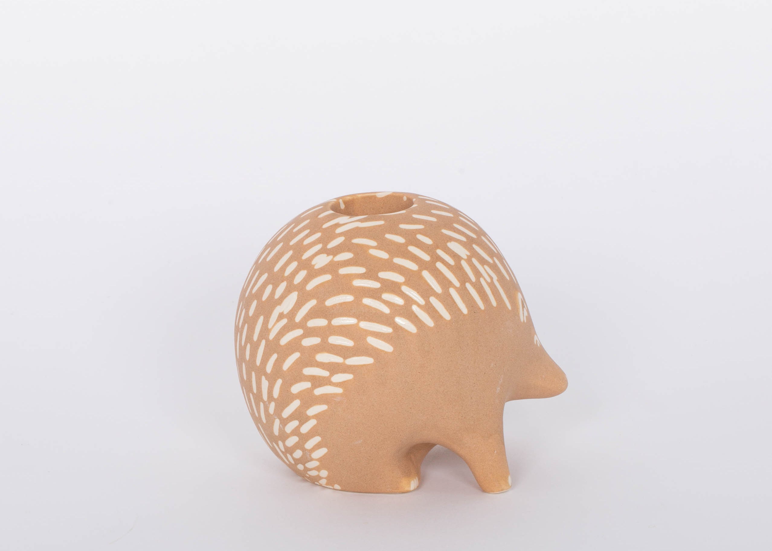 Hedgehog Bramley Candle Holder. Intricate design features carefully crafted metal branches that cradle the candle for a unique and romantic look. Incredibly versatile, this piece can be used to create an intimate ambiance or simply as a beautiful home accent.
