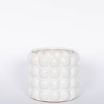 Mindful Modern collection Bubble pot matte white finish and four rows of bubbles. Fits a 4.5 drop in orchid pot.  White background.