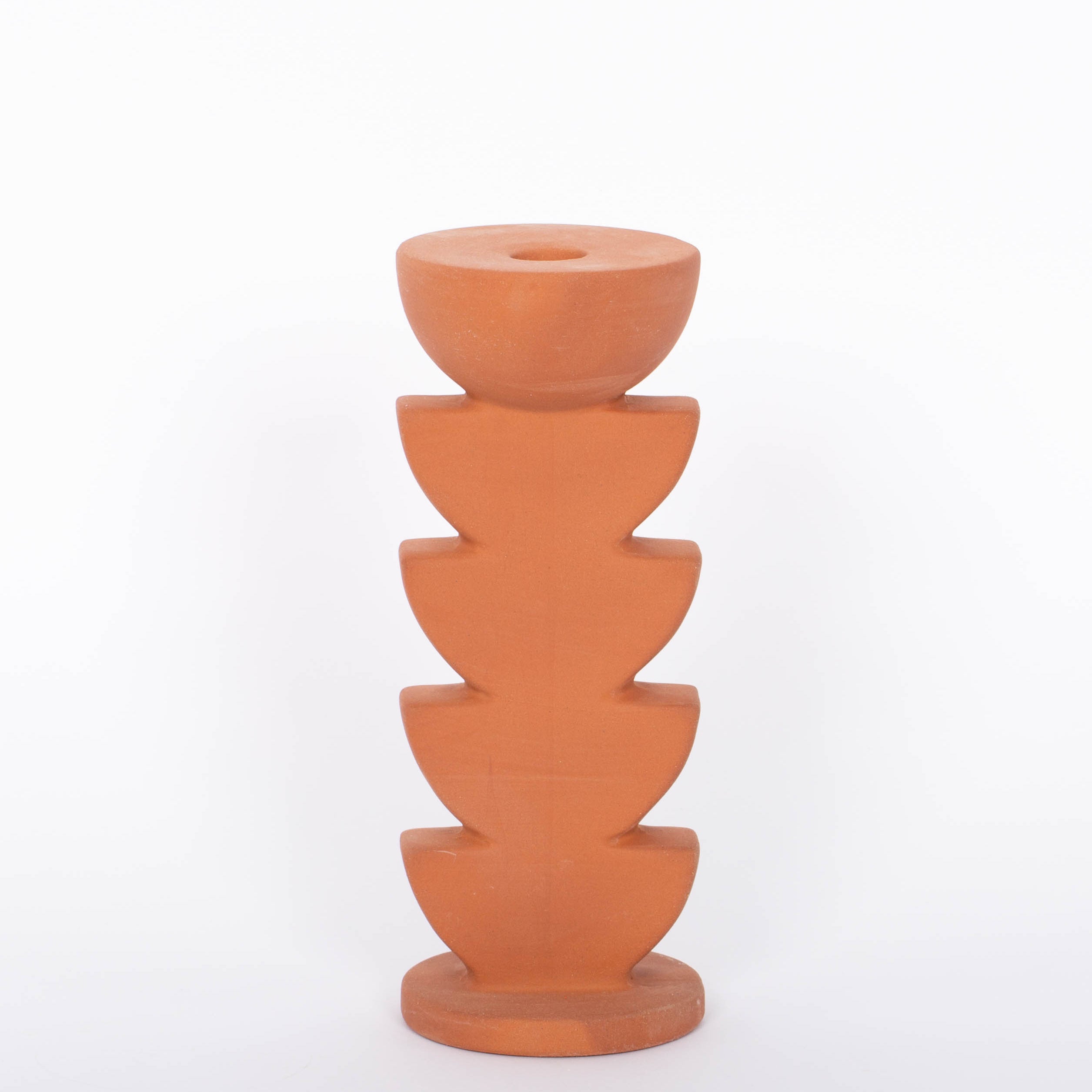 Cadwell Candle Holder stacked half moon design in natural terracotta for taper candles. White background.
