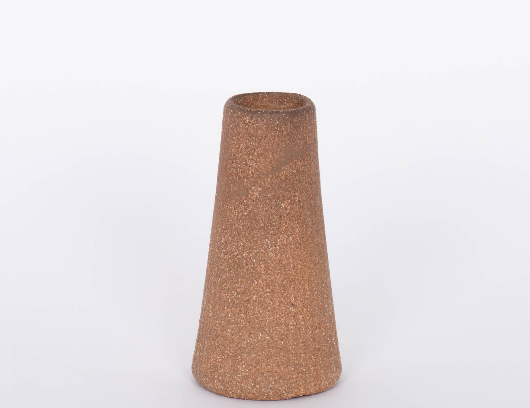 Reddish brown terracotta Canyon Candleholder base by Citrine. White background.