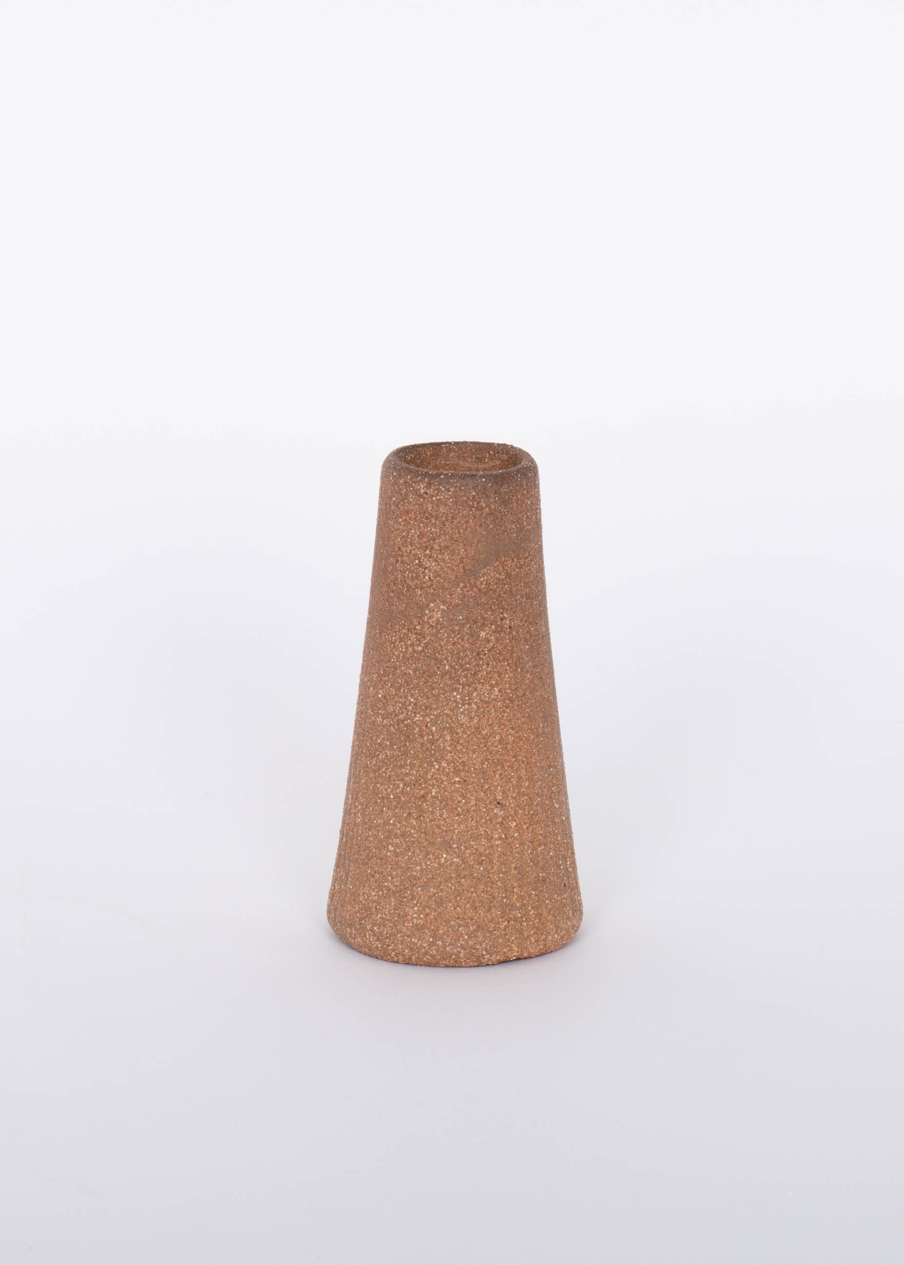 Reddish brown terracotta Canyon Candleholder base by Citrine. White background.