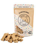 Dog treats with a branded packaging on a white background