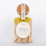 Yellow tip Safety Matches by Paddywax in clear jar and cork ball lid.  White background.