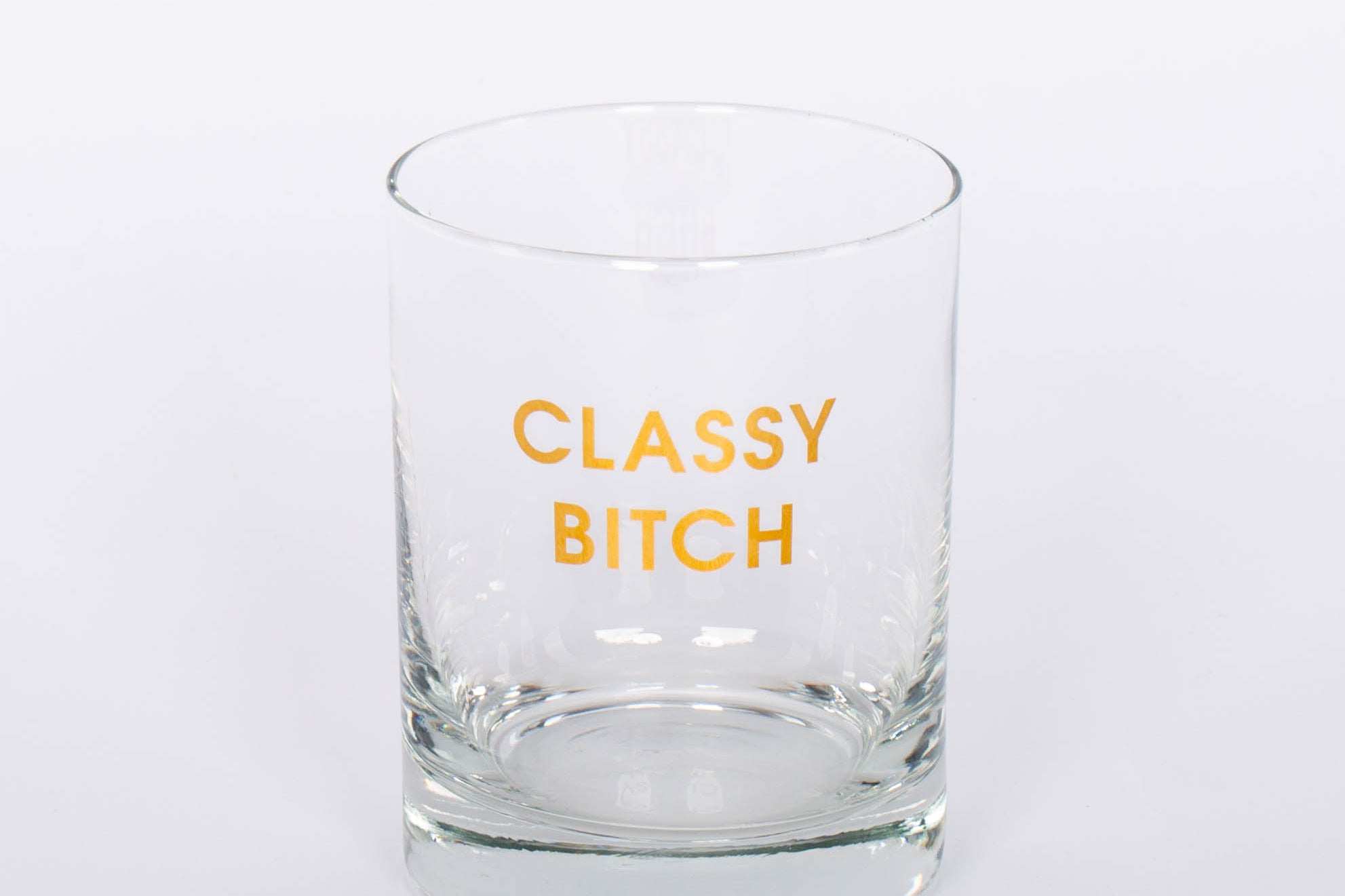 Crush your cocktail in style with our "Classy Bitch" gold foil rocks glass.