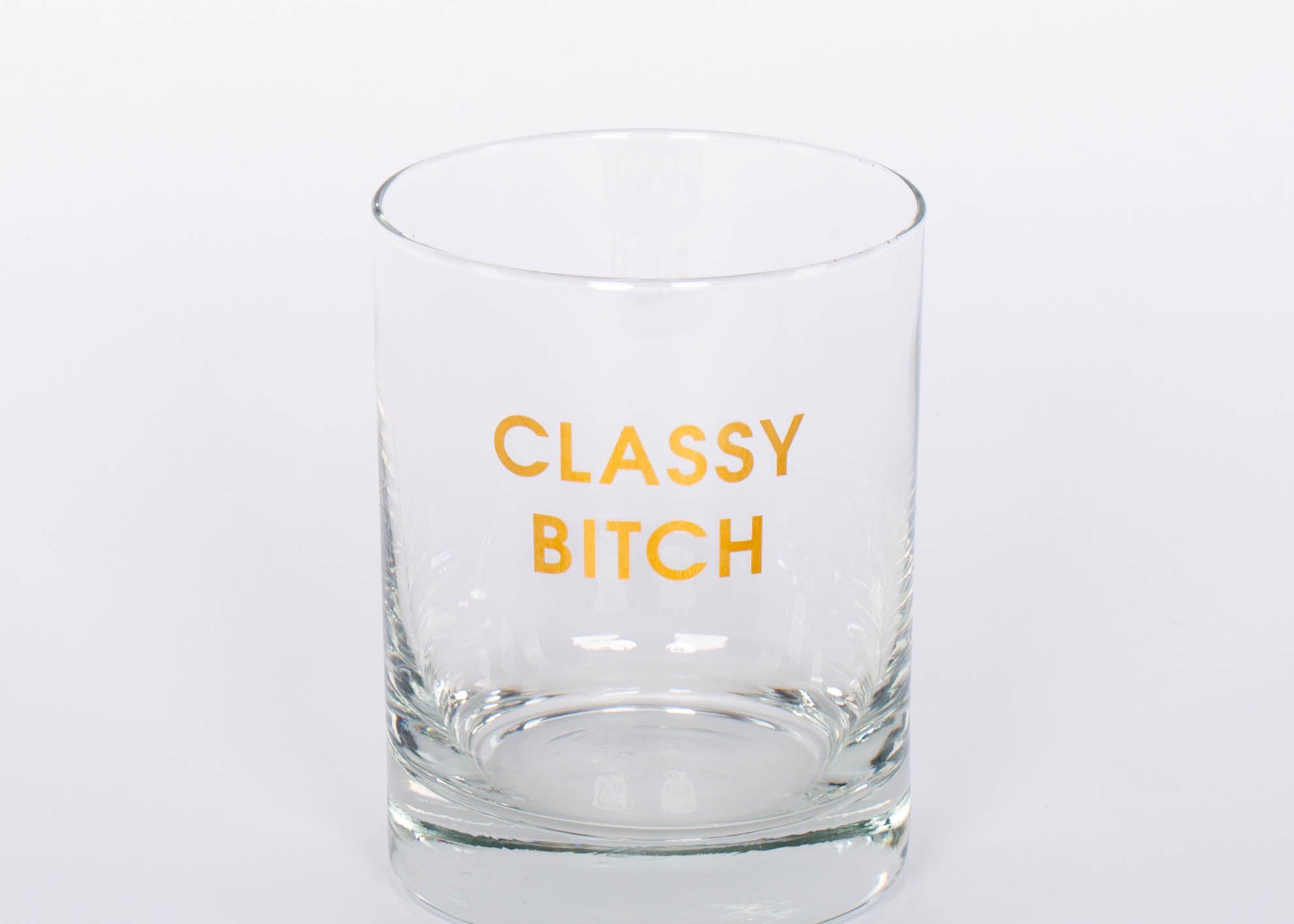 Crush your cocktail in style with our "Classy Bitch" gold foil rocks glass.