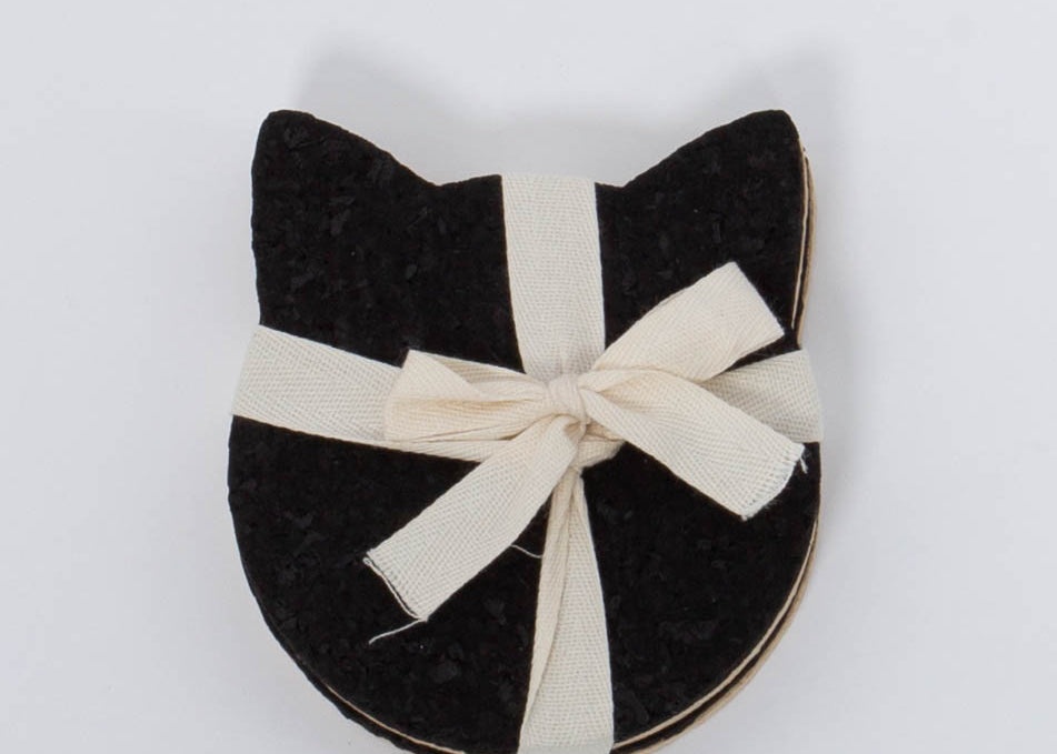 Four pack of 100% Recycled Cat Head Rubber Coaster Set in tan and black by Ore Originals.