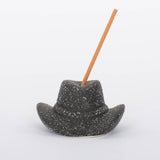 Black Cowboy Hat Incense Holder This vintage-inspired incense burner is on of our favorites! Including 100 fragrant incense sticks of Palo Santo Suede, this ceramic incense holder will keep your space burning with ambiance and fragrant tones.