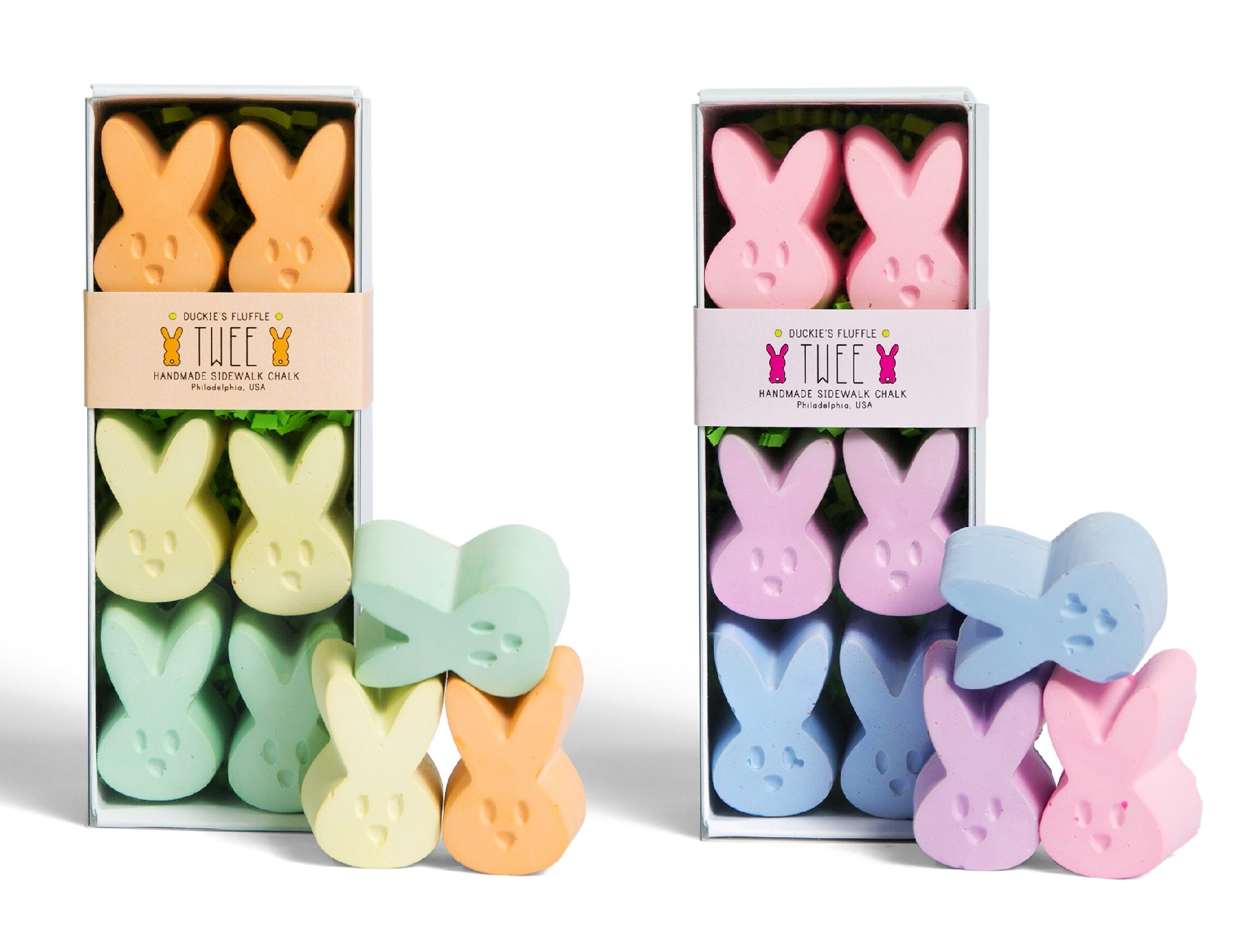 Two boxes of bunny shaped children's chalk. Yellow, orange, green, blue, purple, and pink. White background. TWEE brand.