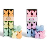 Two boxes of bunny shaped children's chalk. Yellow, orange, green, blue, purple, and pink. White background. TWEE brand.