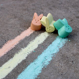 TWEE children's bunny chalk used on pavement in yellow, blue, and orange. 
