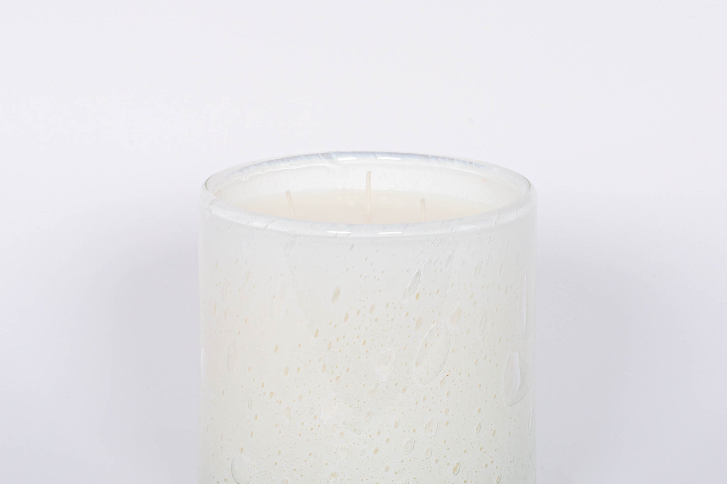 Fleur Blanche Cylindre white bubble glass candle by Alixx with moonflower and violet aroma. White background.
